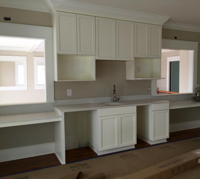 Here is a theater room that we made cabinets for in St. Johns Island, SC. The door style is a number 91 and it is painted Pure White.