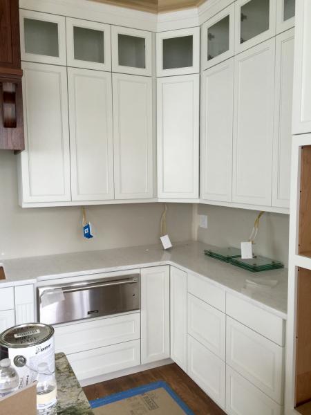 This is the kitchen perimeter cabinets. Door style is a number 91, and they are painted Pure White.